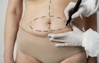 front-view-woman-with-marker-traces-belly_23-2149349968